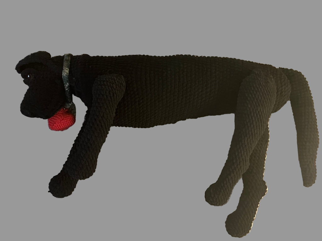 Black full-size crocheted dog plush with dog collar and heart-shaped voice recorder.